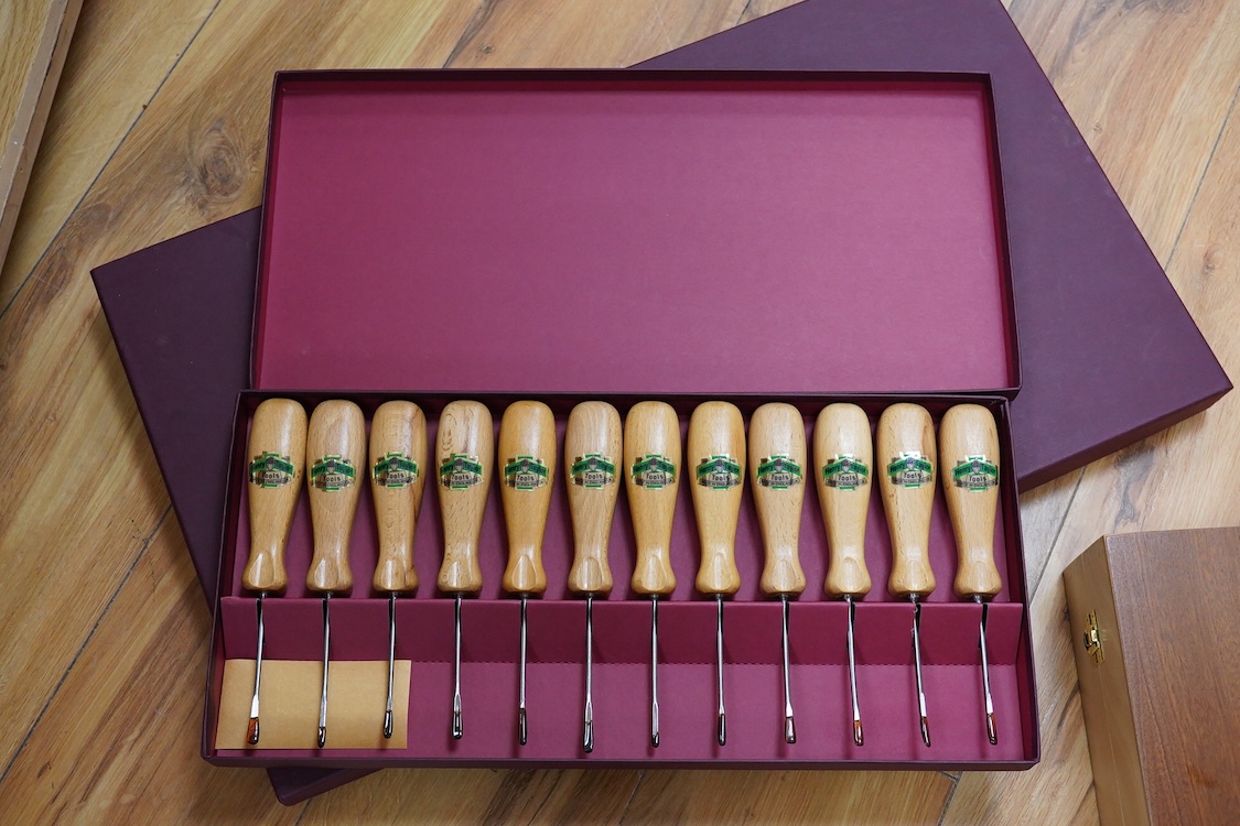 Three sets of Henry Taylor Tools Limited of Sheffield, wood carving chisels, comprising of a 12-carving chisel set contained within a fitted beech case, a set of 17 skew gouges in a fitted card case, and a set of 12 micr